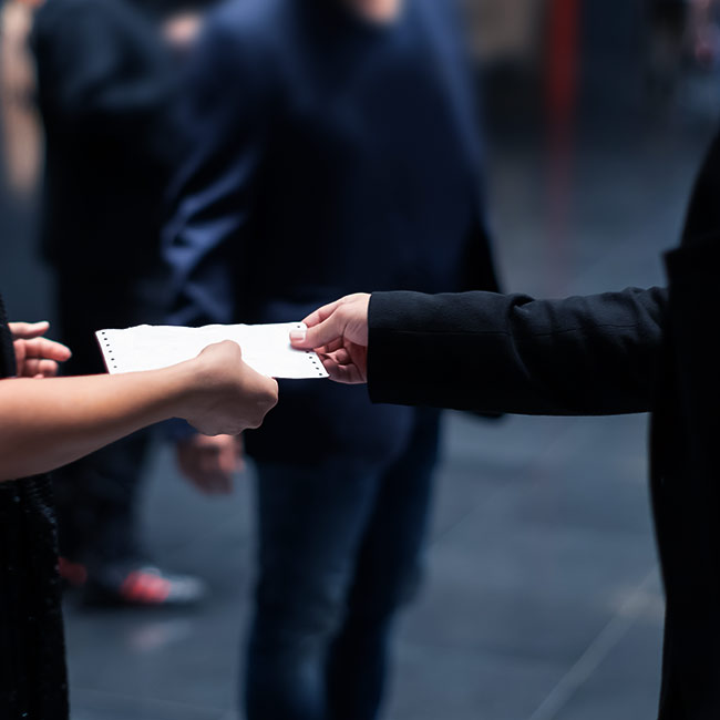 security guard checking a persons event ticket battle creek mi