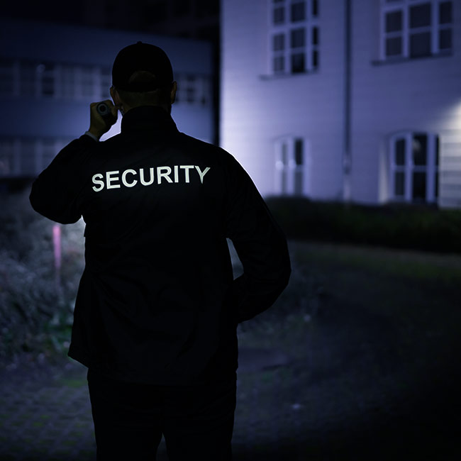 security guard checking an apartment complexs outdoors battle creek mi