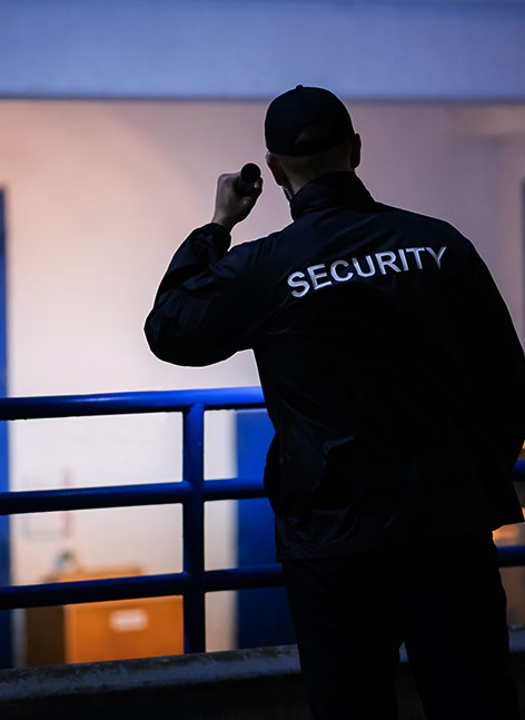 security guard patroling a building at night battle creek mi