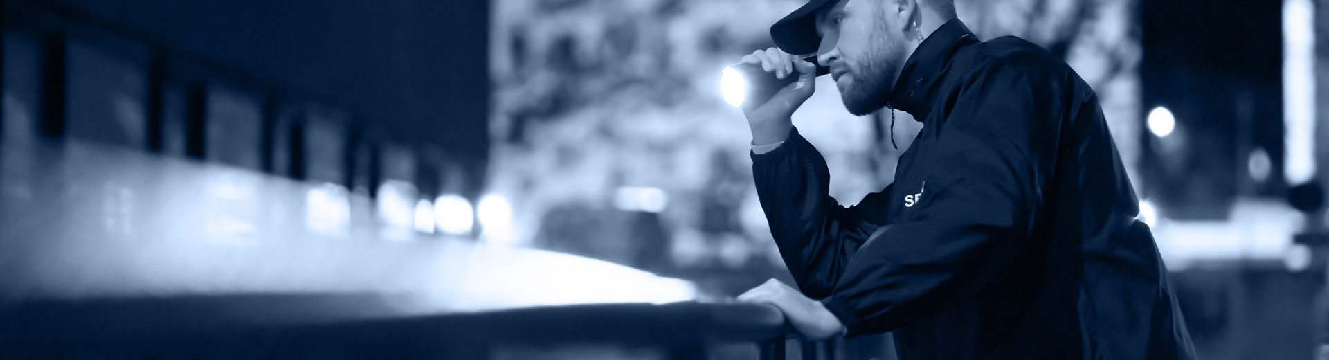 security guard pointing his flashlight battle creek mi